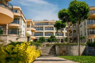 an apartment building with stairs in front of it at Arapya Sun Resort in Arapya
