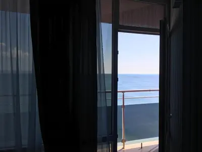 a view of the ocean from a hotel room window at Hotel Sunny Bay Pomorie in Pomorie