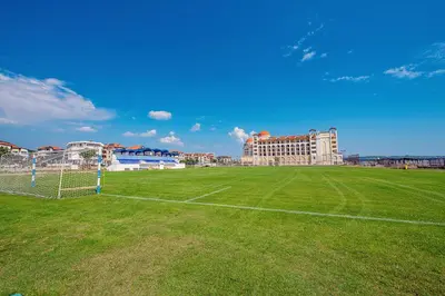a soccer field in front of a building at Hotel Santa Maria in Obzor