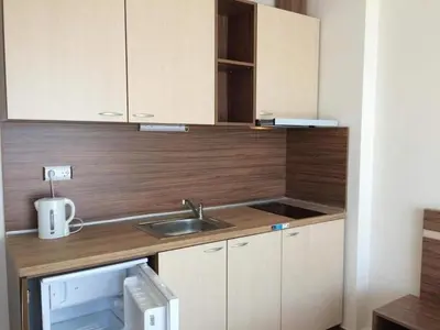 a kitchen with a sink and a counter top at Flower Street provides accommodations with free Wifi, air conditioning in Sunny Beach