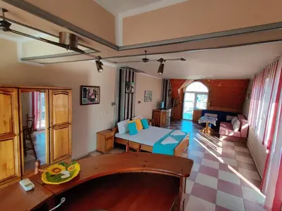 a living room with a couch and a table at Art Villa Rozalia in Ravda