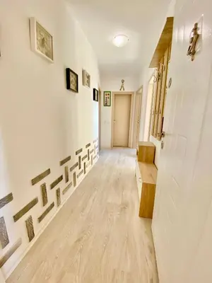 an empty hallway with white walls and wooden floors at Sea View NewApartment-Bulgaria-Chernomorets in Chernomorets