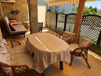 a table and chairs on a balcony with a table at Аппартамент в Триумфе Святой Влас 300м от моря, бассейн. in Sveti Vlas