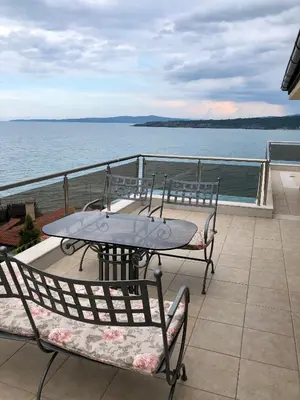 a table and chairs on a balcony with the ocean at Solinaria Boutique Hotel in Sozopol