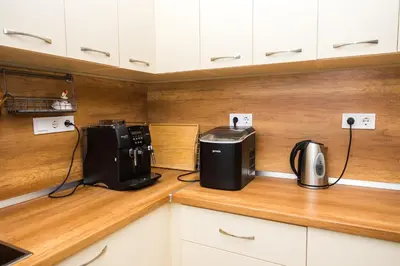 a kitchen counter with a coffee maker and a toaster at Luxury House In Chervenka next to Gradina beach in Chernomorets