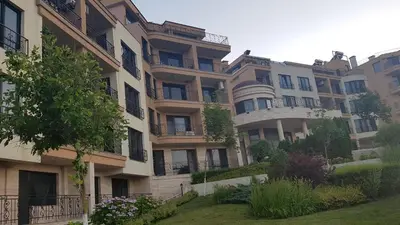 a large building with balconies on the side of it at VIP Sunrise Apartment in Lozenets
