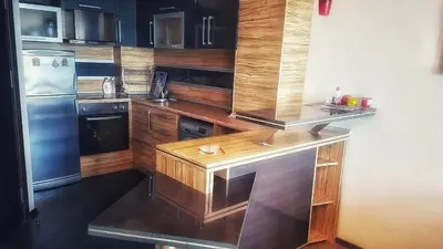 a kitchen with a wooden counter and a refrigerator at VIP Sunrise Apartment in Lozenets
