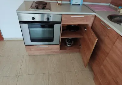 a small kitchen with a stove and a sink at Debbies 2 bed apart with pool and garden views in Sunny Beach