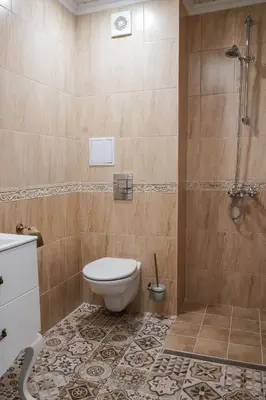 a bathroom with a toilet and a shower at Sunny Apartments Obzor in Obzor
