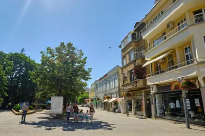 a group of people walking down a city street at Luxury Nevena Apartment - Bogoridi super centre in Burgas City