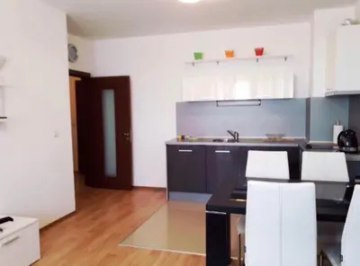 a kitchen with a black counter and white cabinets at Mare Nero in Sozopol
