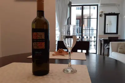 a bottle of wine and a glass on a table at Studio at 