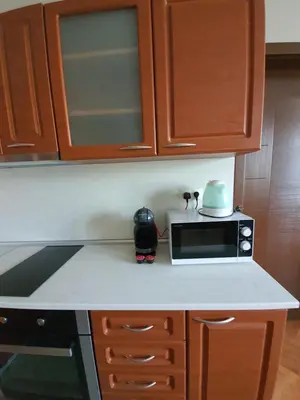 a kitchen counter with a microwave and a toaster oven at Danny apartment in Burgas City