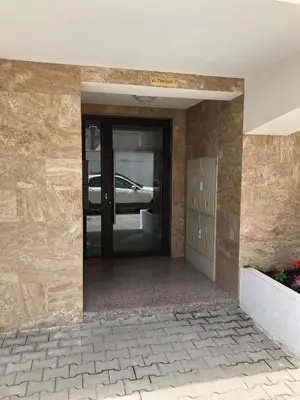 an entrance to a building with a glass door at Sunny Shore Burgas Apartment in Burgas City