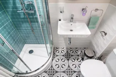 a bathroom with a shower and a sink and a toilet at The Cozy Studio, Varna City Centre in Varna City