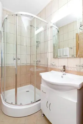 a bathroom with a shower and a sink at Byala Panorama Resort in Byala