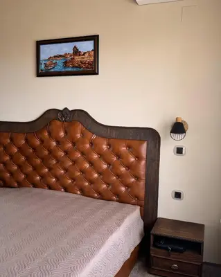 a bedroom with a bed and a picture on the wall at Marina Bay Apart Saint Vlas in Sveti Vlas