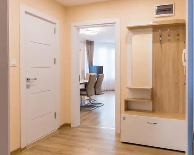 a room with a closet and a desk in the background at Comfy home in the heart of Burgas in Burgas City