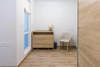 a room with a desk and a chair next to a window at Comfy home in the heart of Burgas in Burgas City