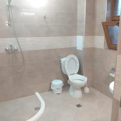 a bathroom with a toilet and a shower at Time out in Sozopol