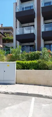 a fire hydrant on the side of a street with a building at Anthic 7 Apartment 3 in Sozopol