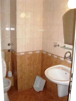 a bathroom with a toilet and a sink at Tony Guest House in Sozopol