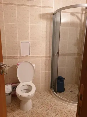 a bathroom with a toilet and a shower at Hotel Royal Dreams Privat Apartment in Sunny Beach