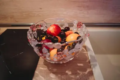 a glass bowl filled with fruit on top of a stove at Andreya's Sea apartment-Beach, Sea garden ,Old Town, Free Parking, Free EVcharging Station in Varna City
