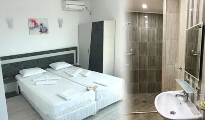 a bedroom with a white bed and a sink at Hotel Pacific Palma in Sunny Beach