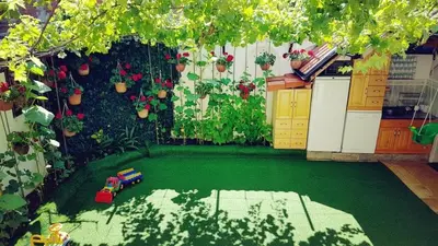 a miniature garden with a toy train in a backyard at Апартамент КИМАКО, 100м2 на цена за хотелска стая за двама in Tsarevo