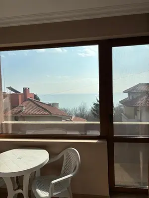 a view from a window with a table and chairs at Relax Guest House in Burgas City