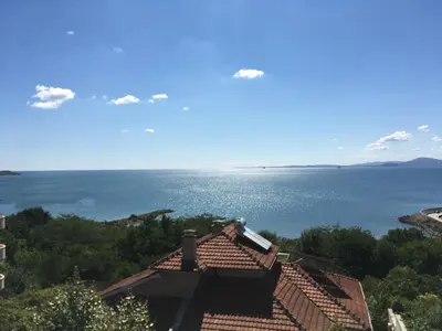 a view of the ocean from a house at Relax Guest House in Burgas City