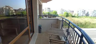a balcony with a bench and a view of a city at River park in Sunny Beach
