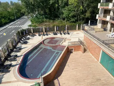 an empty swimming pool on the side of a building at River park in Sunny Beach