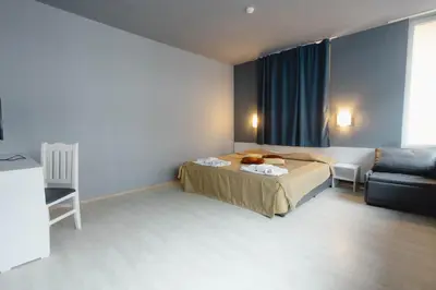 a hotel room with a bed and a couch at Sun Palace Hotel - All Inclusive in Sunny Beach