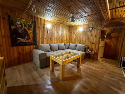 a living room with a couch and a coffee table at “River Romance” Villa in Kamchia