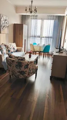 a living room with a couch and a table at Luxury Apartment Azure Coast Panorama in Burgas City