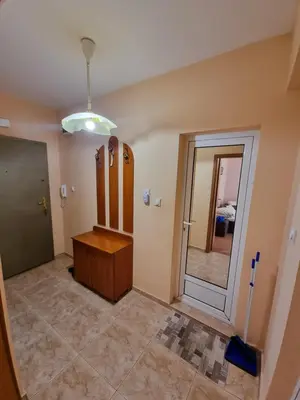 a room with a mirror and a dressing room at Нашето място in Pomorie