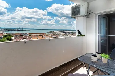 a balcony with a view of a city at Апартамент за гости ВО1 in Burgas City