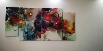 a group of four paintings hanging on a wall at Apartment in Varna City