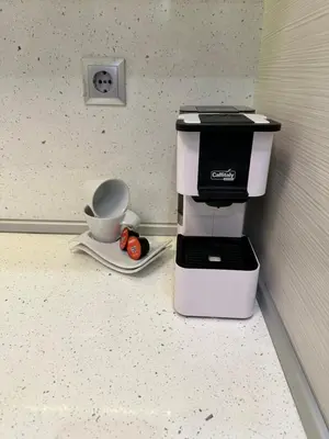 a coffee maker sitting on top of a counter at Apartment in Varna City
