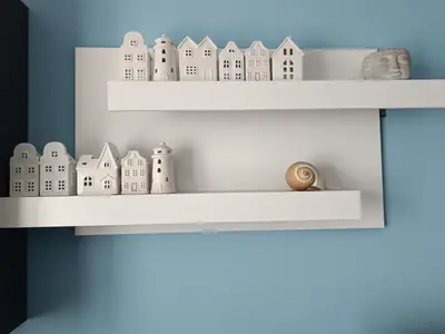 a shelf with toy houses and a snail on it at Guest House Soirée in Nesebar