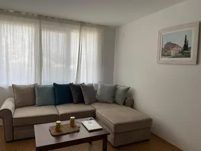 a living room with a couch and a table at Sozopoli Hills Apartment A6 in Sozopol