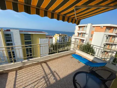 a blue bench on the balcony of a apartment at Sea View Panoramic Apartments, Fort Noks Crown Club in Sveti Vlas