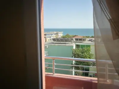 a view of the ocean from a window at Femili Hotel Diveda in Sveti Vlas