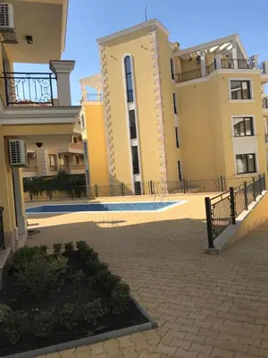 a view of two buildings and a courtyard at Horizon Katrina Apartments - Sea line & Beach Access in Sveti Vlas
