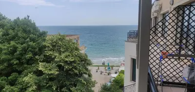 a view of the ocean from a balcony of a building at Ravda on the Beach in Ravda