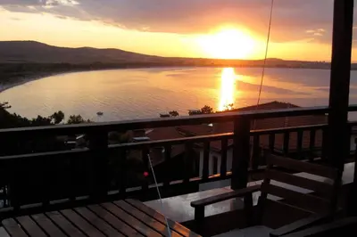 a sunset from the balcony of a house at Santa Marina resort Sozopol - penthouse with amazing sea view in Sozopol