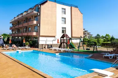 a hotel with a large swimming pool and a playground at House Apartments Black sea Hotel in Obzor