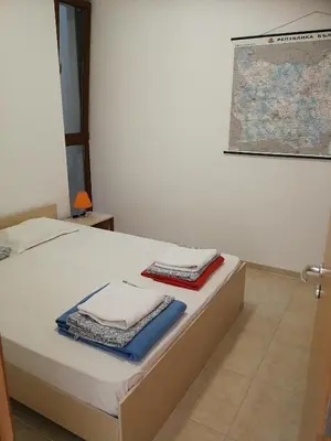 a bedroom with a bed with towels on it at Wonderful family villa with sea view in Byala